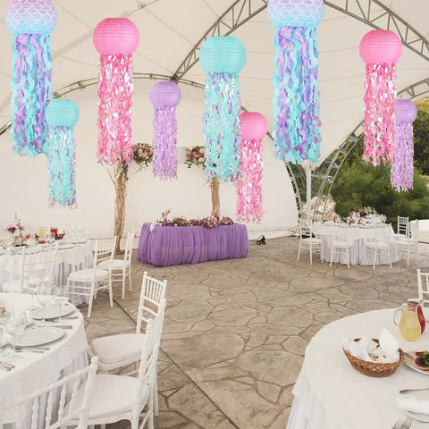 Colorful Jellyfish Paper Lanterns Set Of 6 In Pink Purple And Blue Hanging Lanterns For Mermaid Theme Under The Sea Ocean Birthday Party Decor Totally Vibrant Ocean Life Party Lighting And Backdrop Accents hanging under a canopy at an event.
