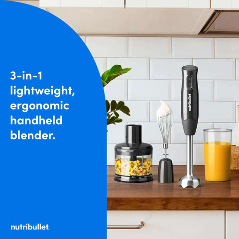 Heavy Duty Yet Slick Handheld Immersion Blender With Rugged Stainless Shaft And Versatile Whisk Hook For Pureeing Soups Whipping Cream And Mixing Batter Like A Pro Without Breaking A Sweat on kitchen counter with chopped veggies.