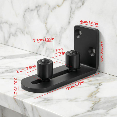 Rock Solid Barn Door Floor Guide 2 Pack With Adjustable Stay Rollers installed, showing black flat bottom flush mount on marble.