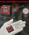 Slick Pocket Sized Digital Angle Finder With Strong Magnet IP54 Waterproof Dustproof Dead On Precision Layout Gauge For Carpentry And DIY No Sweat Compact Measuring Tool You Will Love in hand with coins for size comparison.