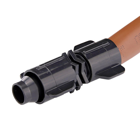Close-up of Raindrip S5600UB universal drip irrigation coupling in black plastic fitted to 1/2–5/8–0.710 in tubing.