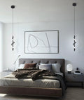 13W Modern Spiral LED Pendant Light Fixture 5500K Cold White Integrated LED Sleek Black Finish hanging in a bedroom.
