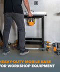 Person adjusting Heavy Duty Universal Mobile Tool Base with 3 inch non marking wheels, 650 lb capacity under power tool stand