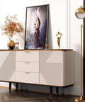 Modern dresser with artistic decor and gold accents in a stylish living room setting
