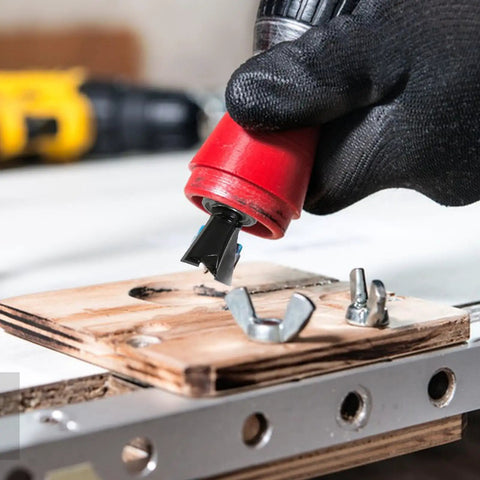 Top Tier Four Piece Dovetail Router Bit Set Featuring Precision Bearing Guides For Cabinetry And Fine Woodworking in use with drill tool.