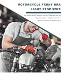 Mechanic installing a right hand brake light switch on a motorcycle front hydraulic master cylinder in a workshop