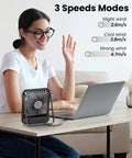 Woman using USB Desk Fan With Dope 7 Blade Design High Airflow Yet Ultra Quiet Personal Cooler next to laptop on desk