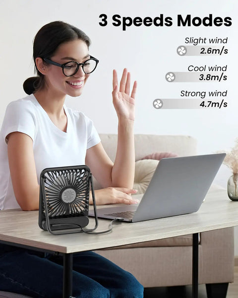 Woman using USB Desk Fan With Dope 7 Blade Design High Airflow Yet Ultra Quiet Personal Cooler next to laptop on desk