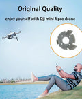 Replacement Rubber Gimbal Shock Absorbers For DJI Mini 4 Pro Drone showing rubber damper and man flying drone over grass.