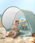 Child playing at beach in Pop Up Baby Beach Tent With UV Protection Lightweight Beach Shelter For Kids Easy Set Up Built In Sand Pockets
