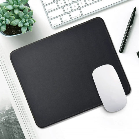 11 Pack Mouse Pads With Reinforced Stitching Edges Washable Non Slip Rubber Base 0.12 Inch Thick Smooth Surface Bulk Desk Pads 10.2 X 8.2 Inches Black on a desk with a mouse