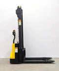 Heavy Duty Electric Thin Leg Pallet Stacker As A No Fuss Heavy Hitter With 2204 Lb Load Capacity and 130 Inch Lift Height viewed from side.