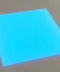 Glow In The Dark Acrylic Sheets One Eighth Inch Thick Sixteen By Twelve Inches Neon Azur For Glowforge Laser Engraving Jewelry Crafting And DIY Projects Ideal For Glowforge And Other Laser Engravers, glowing blue sheet on table
