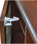 Baby Proof Cabinet Locks With 3M Adhesive Easy Install No Tools Needed No Drilling Universal Fit 8 Pack installed on a wooden cabinet