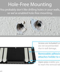 Hole Free Remote Holder sticks to wall with removable adhesive showing no drilling needed, in premium black design.