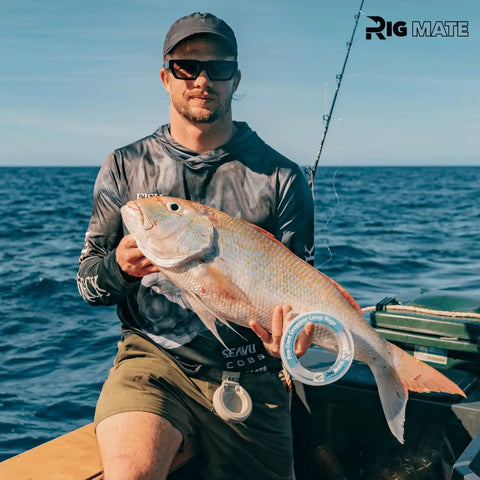 Angler holding snapper with 20 Lb Pre Tied Dropper Loop Rigs On Fishing Line Spool With 18 Inch Loop Spacing And 5.5 Inch Loop Size