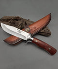 M390 Fixed Blade Hunting Knife With Wood Handle Full Tang Survival Knife Leather Sheath Built For Rugged Outdoor Camping Bushcraft and Beast Mode Wilderness Tasks No Cap displayed on wood background.