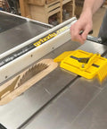 Adjustable Magnetic Featherboard For Table Saws And Router Tables Locks Stock Dead Tight Against Fence shown on a table saw.