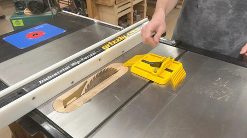 Adjustable Magnetic Featherboard For Table Saws And Router Tables Locks Stock Dead Tight Against Fence shown on a table saw.