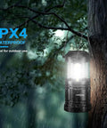 Portable LED Camping Lantern 2-Pack with Battery Operated Lights hanging on a tree in rain, 360-degree illumination, outdoor use