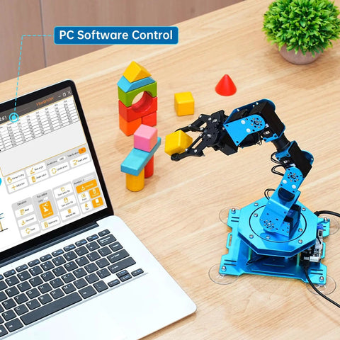 Blue 6-axis metal robotic arm kit on a desk beside a laptop displaying PC software control UI.