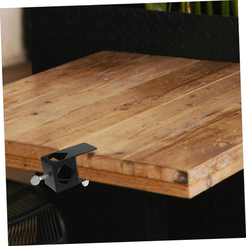 Heavy Duty Torch Clamp Holder Mount For Deck Lights And Tiki Torches On Porches Railings And Outdoor Spaces installed on wooden surface