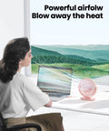 Person using Must Have USB Desk Fan Pink Five Point Five Inch Mini Portable Quiet Personal Desktop Cooler in home office with laptop