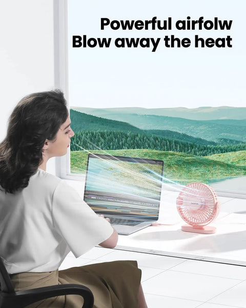 Person using Must Have USB Desk Fan Pink Five Point Five Inch Mini Portable Quiet Personal Desktop Cooler in home office with laptop
