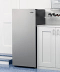 7 Cu Ft Upright Convertible Refrigerator And Freezer With Manual Defrost And Garage Ready Build In Brushed Stainless Steel in a modern kitchen setting.