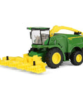 One Sixty Fourth Scale Farm Harvester Toy with swiveling spout, metal frame, plastic forage head, five inch model for kids three and up