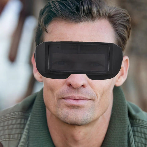 Badass Auto Darkening Welding Goggles Featuring Kickin Wraparound Coverage And Legit Precision Lenses For Ultimate Electric Arc Eye Protection Gear worn by a man.