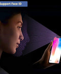 Woman using Face ID on smartphone at night, blue icon displaying support for facial recognition technology