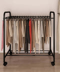 No Sweat Expanding Floor Standing Pants Hanger Rack Built For Glide Like Silk Motion On Hardwood Tile Floors With Secure Locking Brakes, displaying multiple garments on a black metal frame.