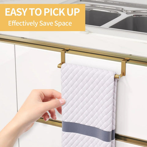 Gold stainless steel over the cabinet door towel rack with quilted towel, tool-free installation on kitchen cupboard.