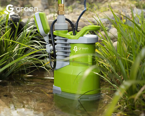 Boss Level 1.5HP Submersible Sump Pump With 5000 GPH Flow, in green, placed in a pond with plants, showing 25 ft cord