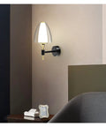 Straight Up Modern Led Wall Sconce With Soft Glowing Acrylic Shade Lights Up Bedroom Dining Room Hallway And Stairs Easy To Mount Durable Design Adds Style Points, mounted on a wall near a bed.