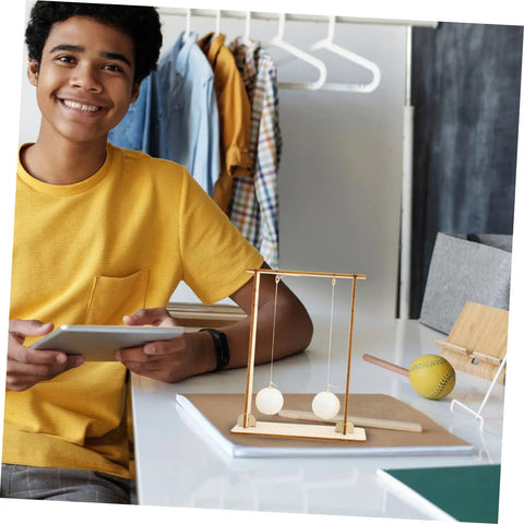 Teen holding tablet with Two Piece Physics Experiment Kit With Floating Ball Tools For School Learning Safe Materials on desk