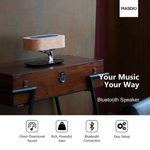 Masdio Bedside Lamp With Bluetooth Speaker And Wireless Charger on wooden desk, featuring cherry wood shade and modern design.
