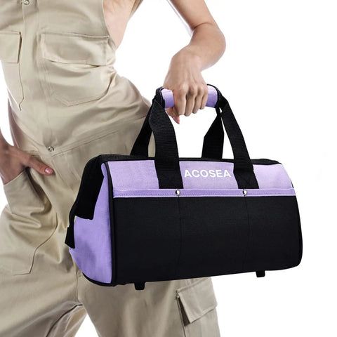 Person holding Purple Tool Bag With Wide Mouth Opening And 12 Storage Pockets, 13 Inch Tool Organizer, Water Resistant Durable Construction.
