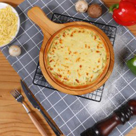 Upgrade Your Holiday Cooking Game With This No Sweat Manual Pizza Dough Press Machine Heavy Duty Construction Perfect For Rolling Tortillas Sheet Fresh Pasta And Crushing Out Flawless Pie Crusts At Home: pizza cooked in a wooden round dish, surrounded by fresh ingredients.