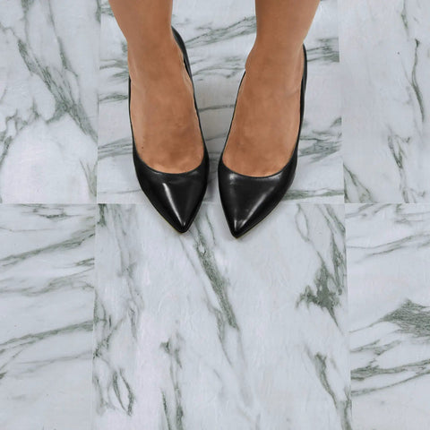 Feet standing on Opaline Peel And Stick Floor Tiles White Marble Look Vinyl Flooring for Kitchen Bathroom Entryway