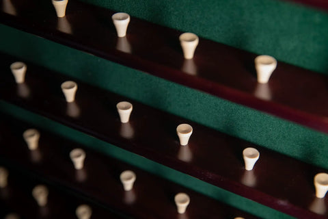 Close-up of interior of 63 Golf Ball Display Case With Door Wall Mount Cabinet In Mahogany Wood Holds Up To 63 Balls