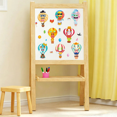 Easel displaying 24 Sheets Hot Air Balloon Make A Face Stickers Set for DIY crafts with decals of cute animals, sunglasses, stars, and rainbows.