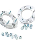 Upgrade Your Polaris UTV Setup With These Heavy Duty 4x156 To 4x136 Wheel Adapters That Drop Your Can Am Rims A Full Inch For Wide Tire Flex Meaner Fitments And Fresh Off Road Stance In Pairs, showing two silver metal wheel adapters with bolts and nuts.