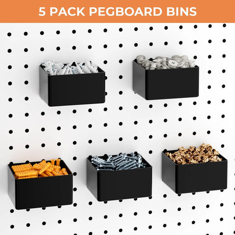 Five black pegboard bins mounted on white pegboard, holding orange wall anchors, screws, nuts, washers, and fittings.