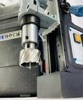 Knockout Performance Heavy Duty Magnetic Drill Press Built Like A Tank For Real Contractors With Two Speed Settings Three Inch Capacity And 1850 Watt Muscle For Any Metal Project close-up of drill bit and control panel.