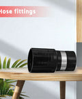 Front view of black 1-1/4-inch central vacuum hose adapter with silver band on wooden table