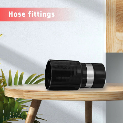 Front view of black 1-1/4-inch central vacuum hose adapter with silver band on wooden table
