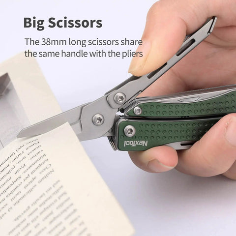 Close-up of EDC Keychain Multitool 10 In 1 Mini Pocket Knife With Needlenose Pliers And Scissors cutting paper, green handle.
