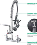 Robust Wall Mount Kitchen Sink Faucet With A Slick Polished Chrome Surface And High Pressure Pre Rinse Sprayer close-up view.